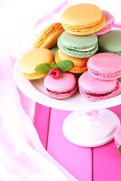 Gentle macaroons in vase on table closeup