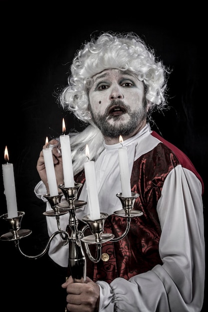 Photo gentleman rococo era wig, chandelier with candles