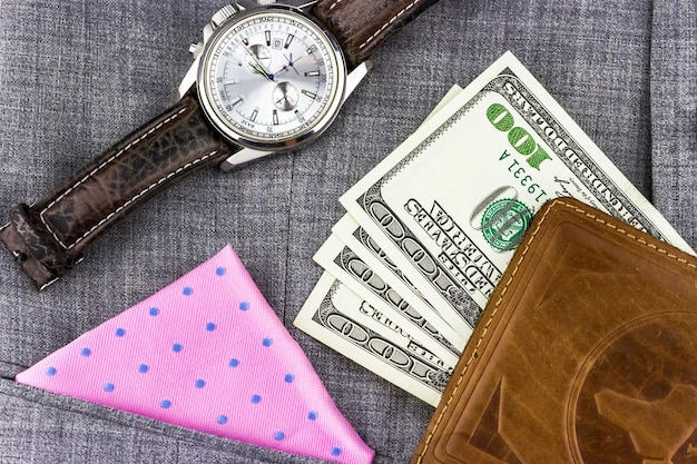 Gentleman's set of watches with a handkerchief and dollar bills