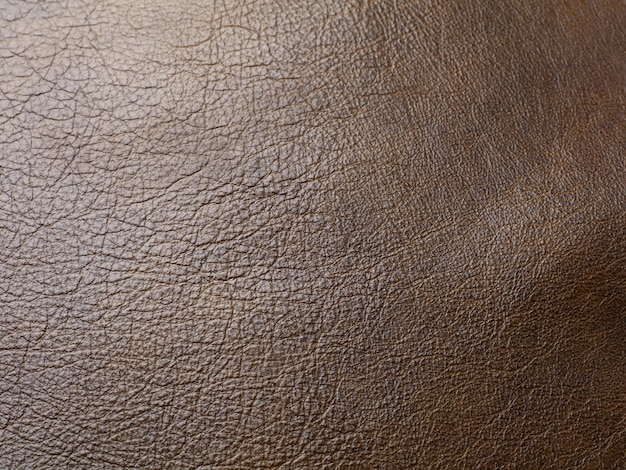 Genuine brown cattle leather texture background. Macro photo