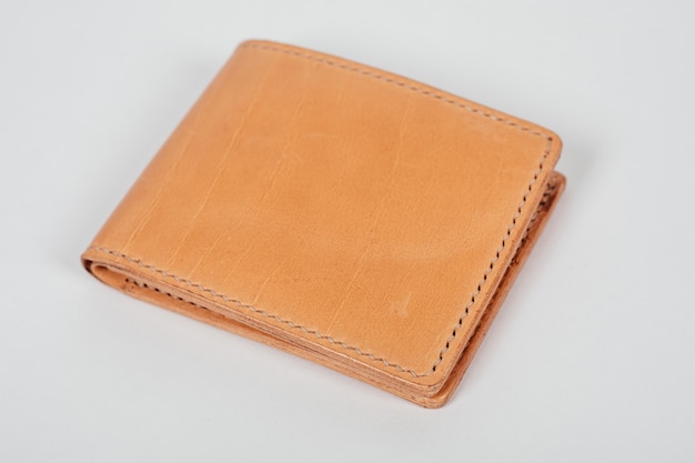 genuine leather wallet brown color on isolated white background.