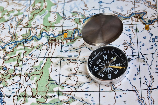 Photo geographical map and a compass