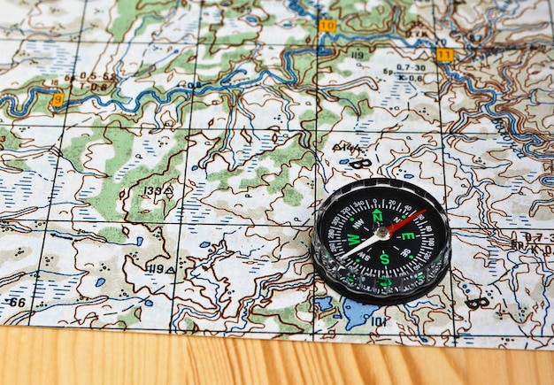 Geographical map and a compass