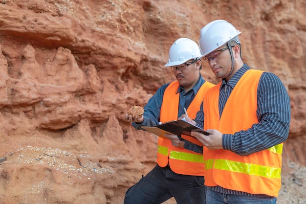 Geologist surveying mineExplorers collect soil samples to look for minerals