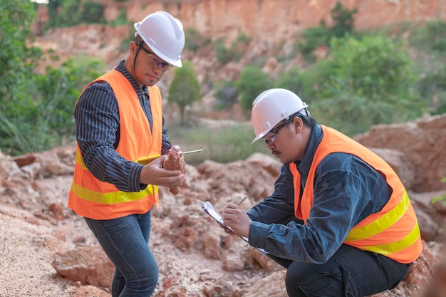 Geologist surveying mineExplorers collect soil samples to look for minerals