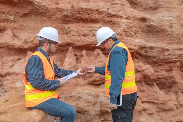 Geologist surveying mineExplorers collect soil samples to look for minerals