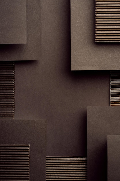 Geometrische zwarte achtergrond van gegolfd karton en papier