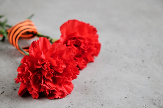 George ribbon, red flowers carnation.