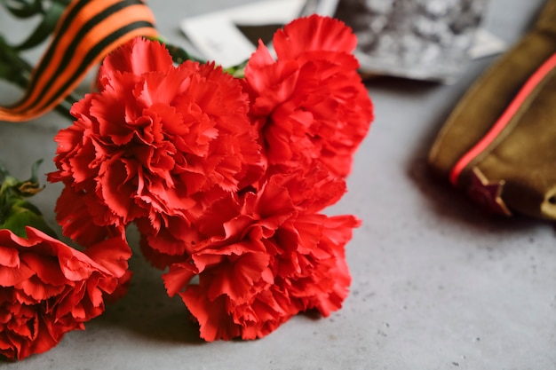 George ribbon, red flowers carnation.