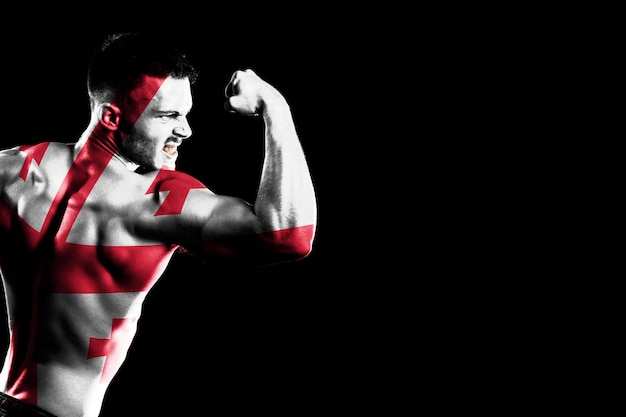 Georgia flag on handsome young muscular man black background