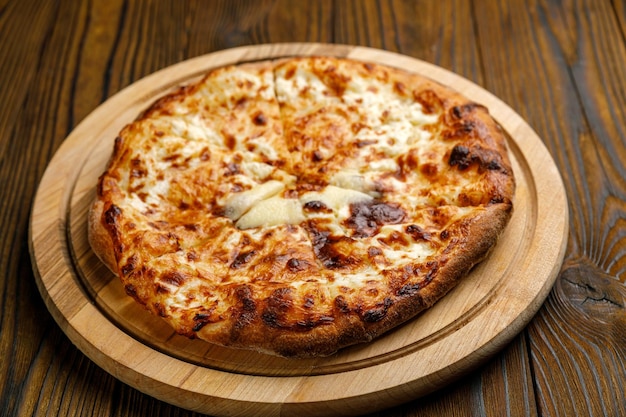 Georgian cuisine Khachapuri on a wooden table