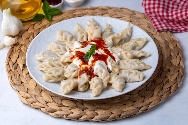 Georgian Dumplings Khinkali with Meat Tomato Sauce and Spices Hingel or Cerkes manti