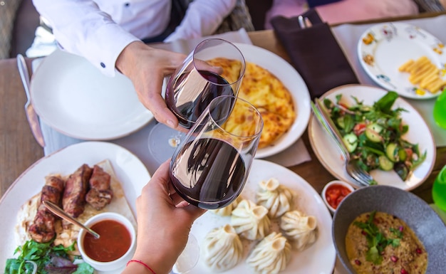 Georgian restaurant food on the table wine in hands