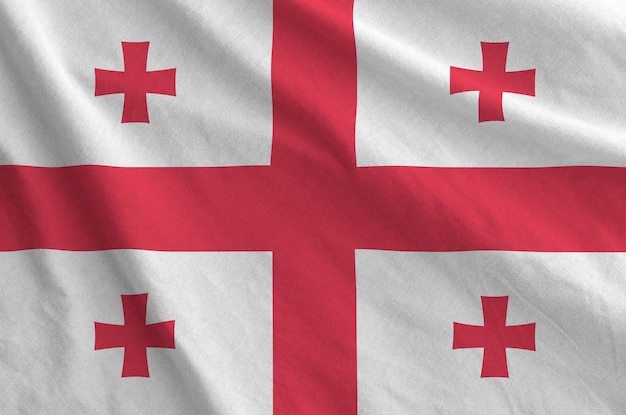 Georgië vlag afgebeeld op gevouwen golvende stof van oude doek