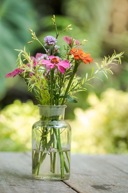 Gerbera flowers in vase adorned in beautiful colors vintage used as background 