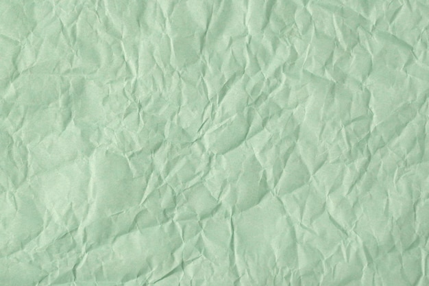 Gerecycled verfrommeld turkoois papier textuur of papier achtergrond voor ontwerp met kopieerruimte voor tekst of afbeelding