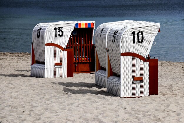 Photo german beach basket chairs on a beach of a north sea - strandkorb