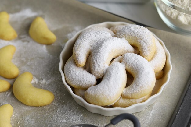 German Christmas pastries vanilla crescent vanillekipferl on white plate with white background