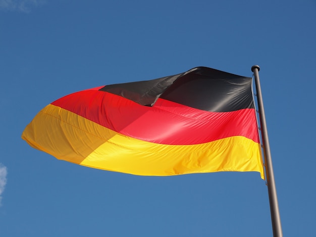 German flag over blue sky