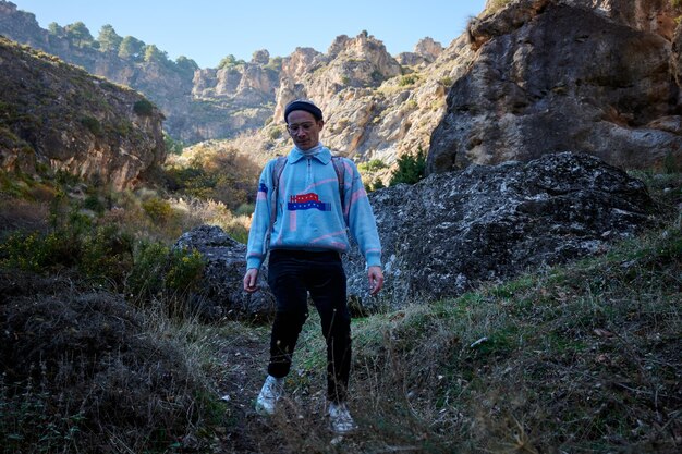 A German male hiker trailing down a hill