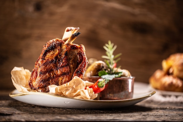 German pork ham hock or Schweinshaxe served in a rustic restaurant.