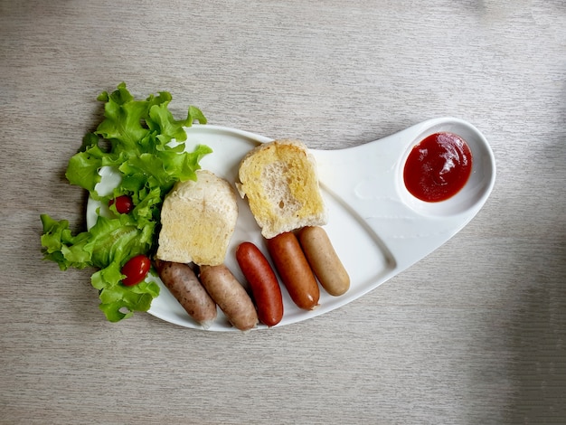 German Sausages with bread and tomato sauce