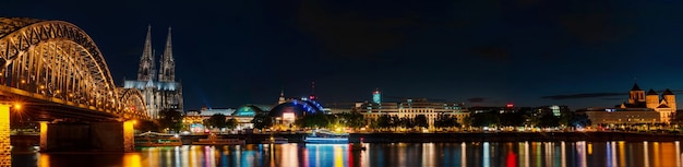 GERMANY COLOGNE THE RHINE EMBANKMENT AT NIGHT the Cologne Cathedral Dom and the Hohenzollern Bridge