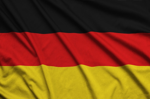 Photo germany flag  is depicted on a sports cloth fabric with many folds.