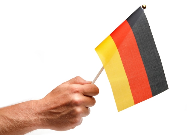 Germany flag small in hand isolate.