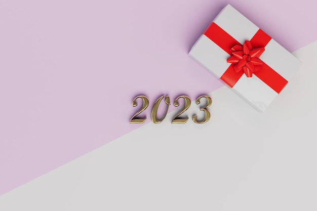 Geschenken voor het nieuwe jaar 2023 een gouden inscriptie 2023 en een geschenkdoos op een pastel witte achtergrond