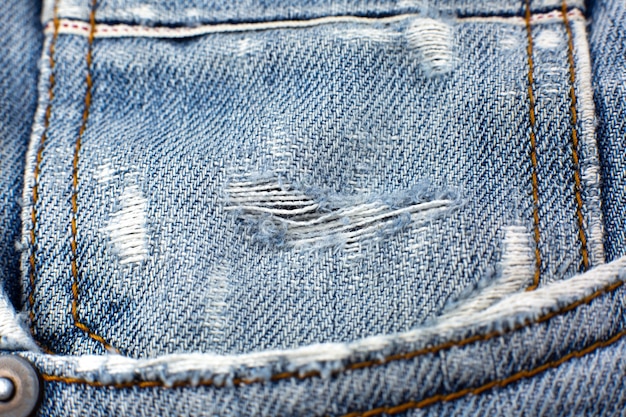 Gescheurd blauw hipsterjeansmateriaal