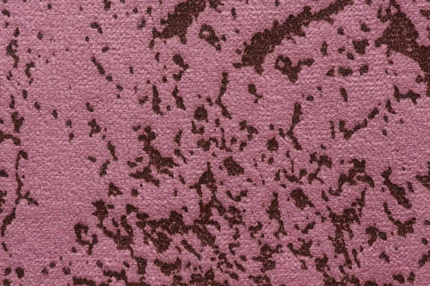 Gespikkelde textielachtergrond in zachte roze toon