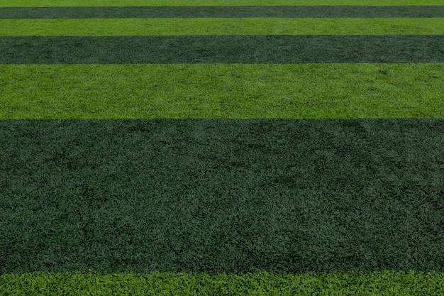 Gestreepte voetbal veld achtergrond, groen gras voetbal veld achtergrond