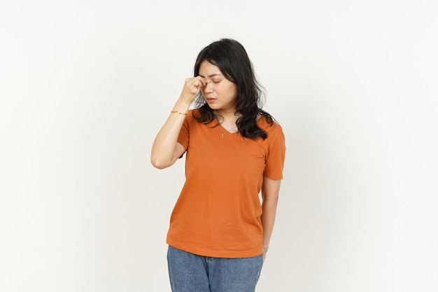 Get Headache of beautiful asian woman Wearing orange Tshirt isolated on white background