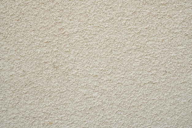 Getextureerde beige pleister op de muur