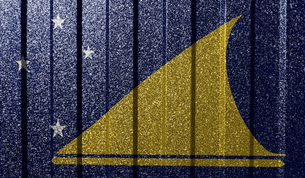 Getextureerde vlag van Tokelau op metalen wand Kleurrijke natuurlijke abstracte geometrische achtergrond met lijnen