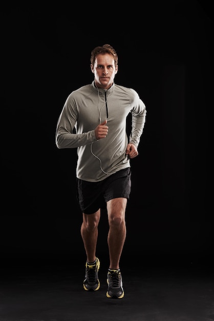 Getting his fitness on Studio shot of a handsome young man in sportswear