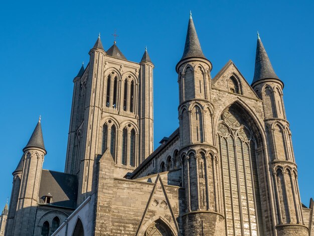 Ghent city scenes in Belgium residential buildings church attractive and beautiful scenes under blue sky