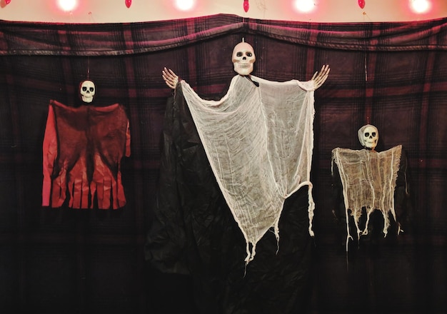 Photo ghost decorations hanging at halloween party