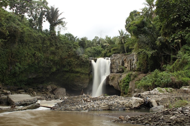 A giant waterfall next to the village of Ubud in Bali