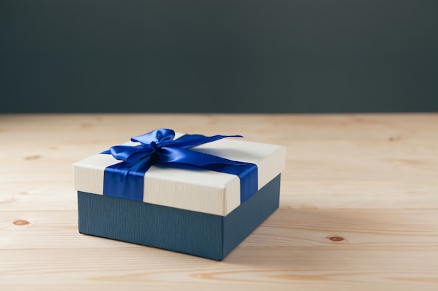 Gift blue ribbon on the table