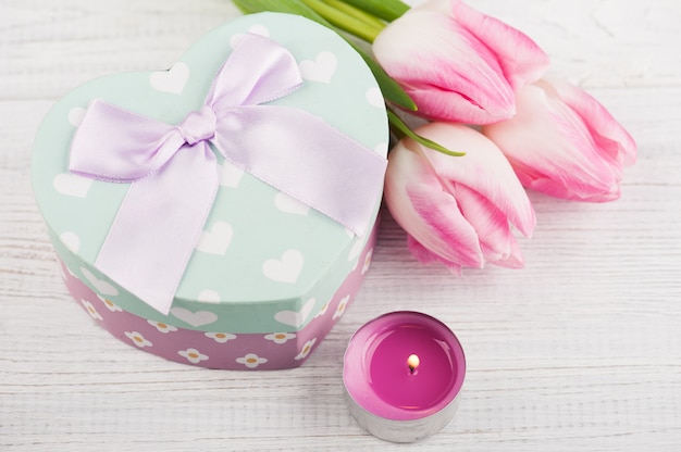 Gift box as heart and tulips