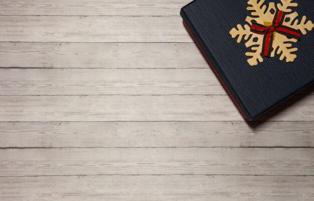 Gift box blue on a wooden background