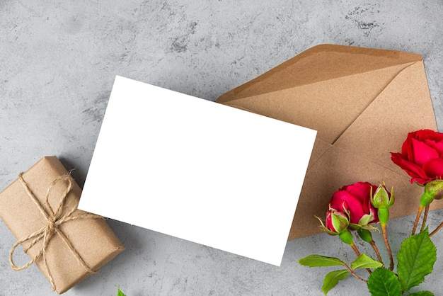 A gift box and a card with roses on it