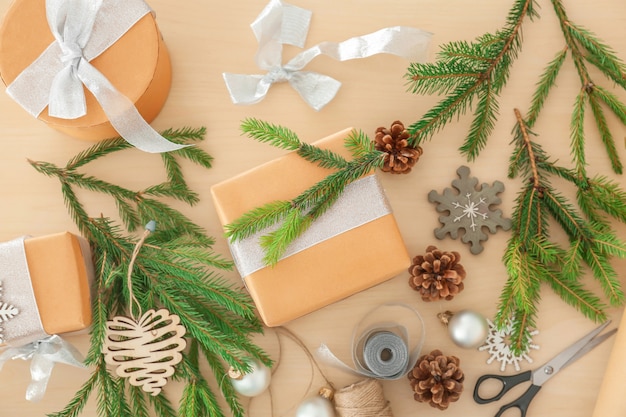 Gift box and Christmas decorations on table