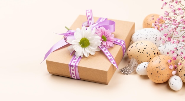 Gift box Easter eggs and flowers