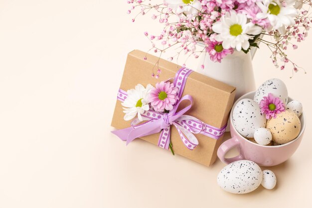 Gift box Easter eggs and flowers