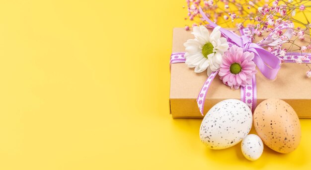 Gift box Easter eggs and flowers