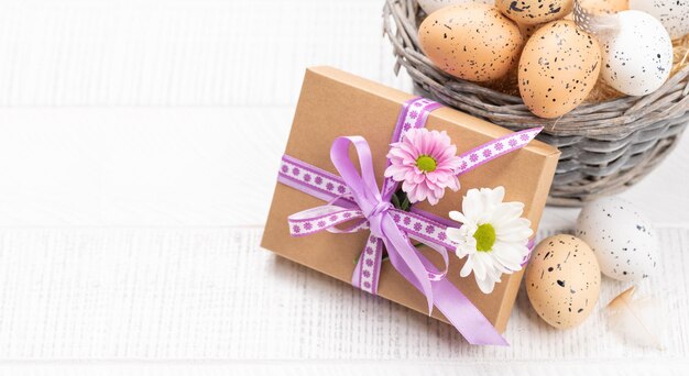 Photo gift box easter eggs and flowers