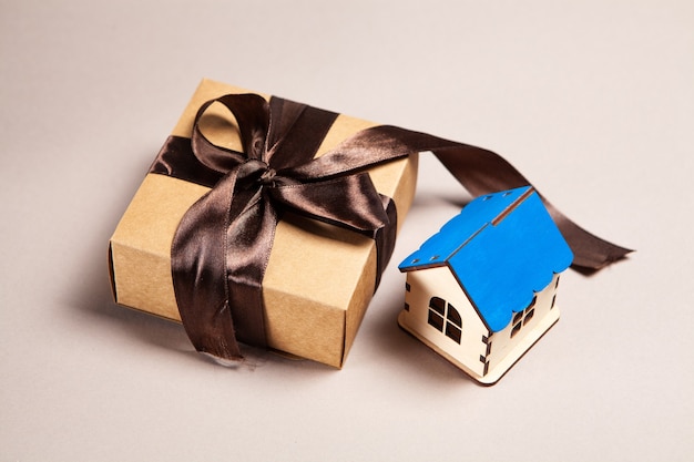 Photo gift box and house. buying a house concept